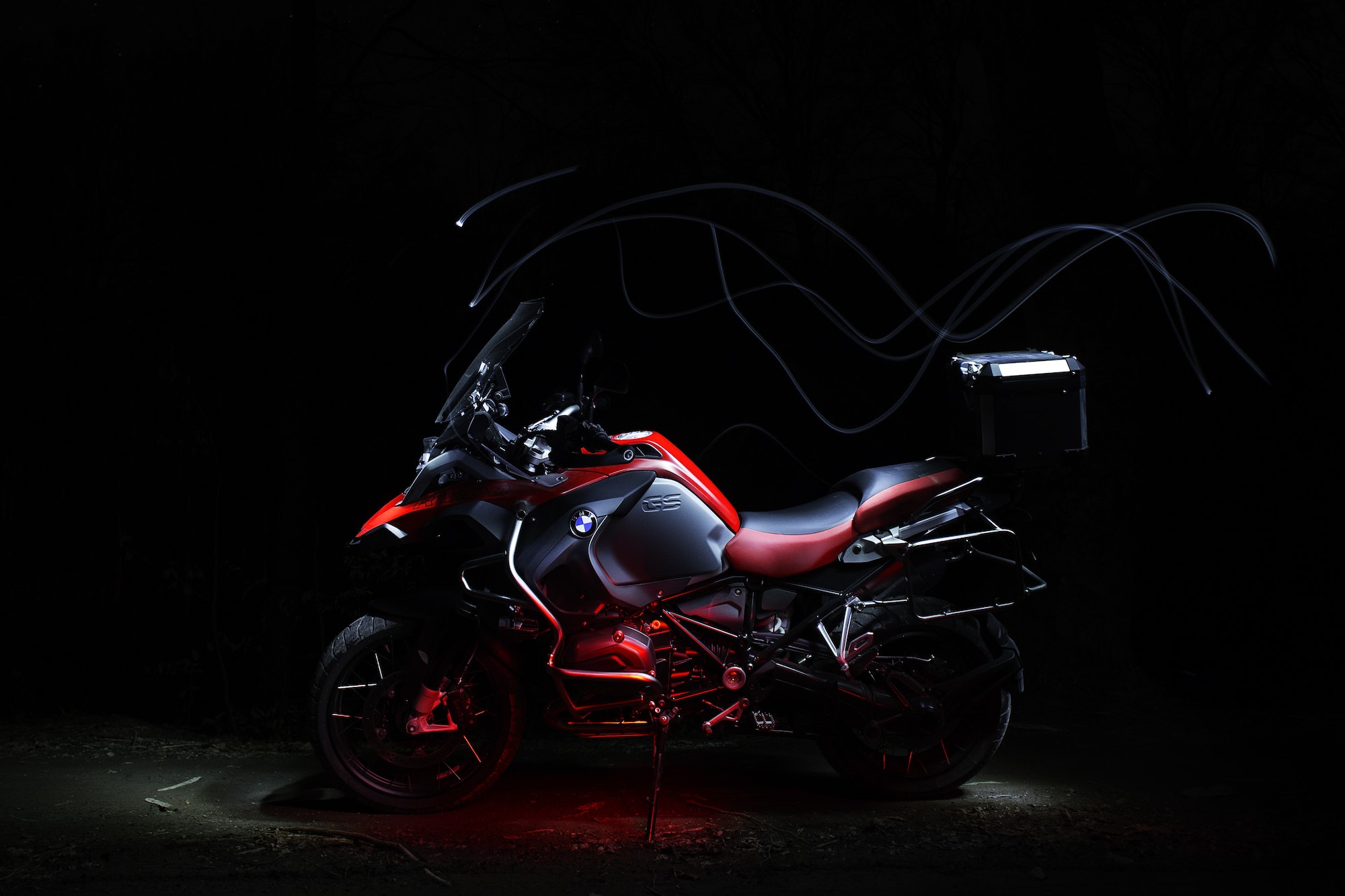 BMW motorcycle with light trails by night